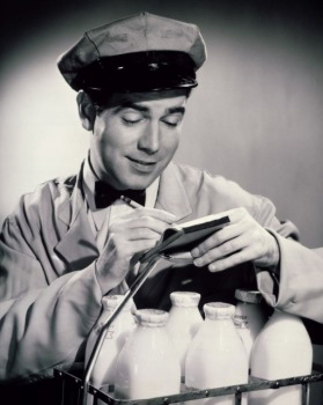 Close-up of a milkman writing on a note pad Canvas Art - (18 x 24)