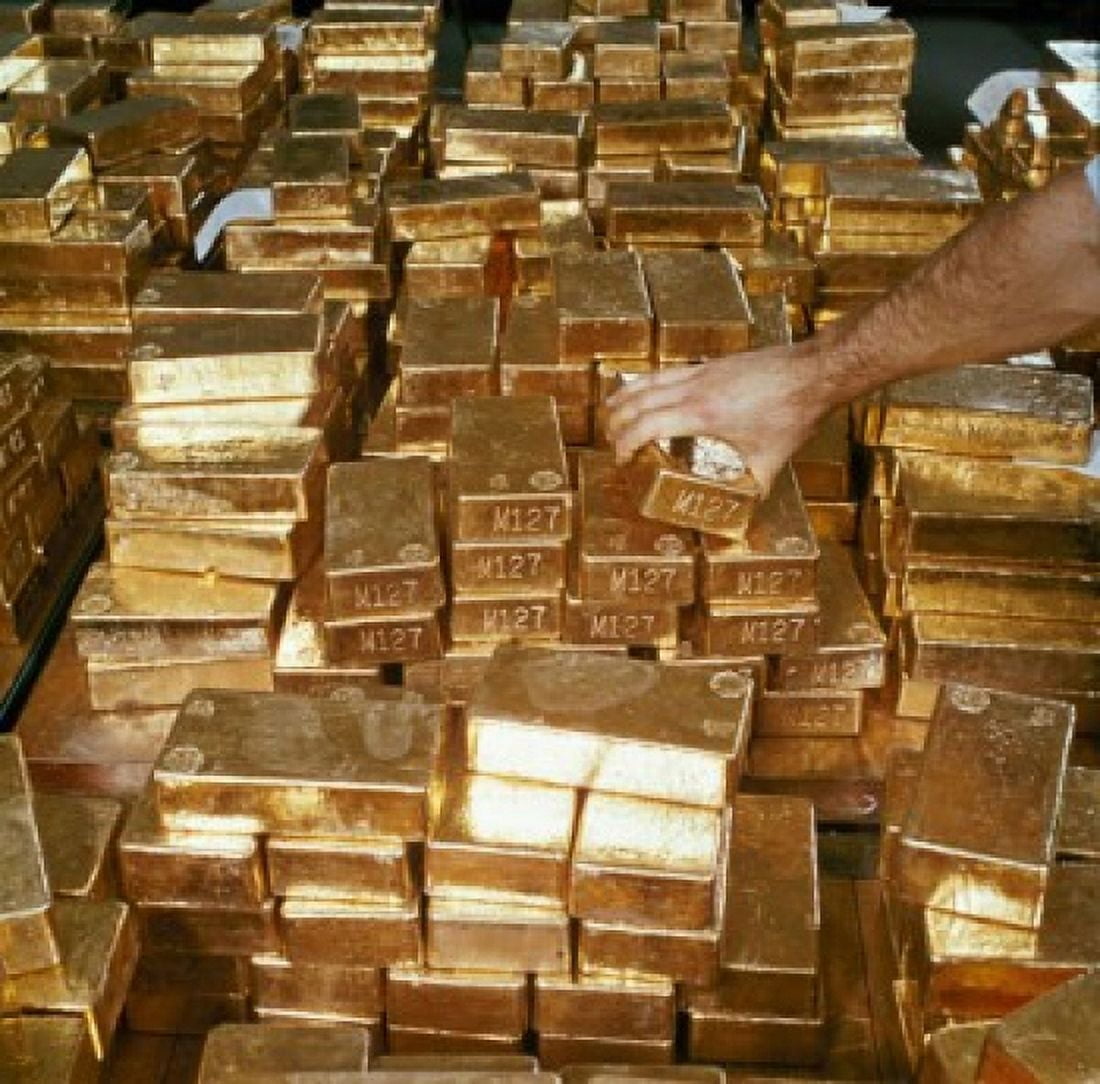 Close-up of a persons hand arranging gold bars South Africa Canvas Art - (18 x 24)