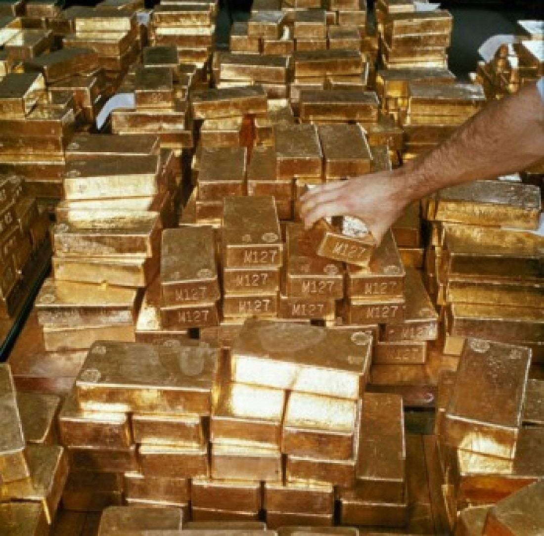 Close-up of a persons hand arranging gold bars South Africa Canvas Art - (24 x 36)