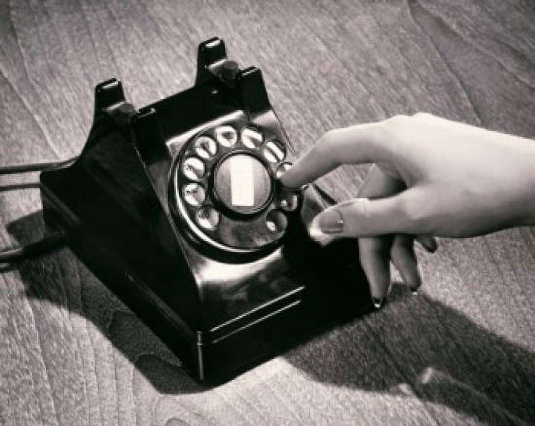 Close-up of a persons hand dialing a number on a rotary telephone Canvas Art - (24 x 36)