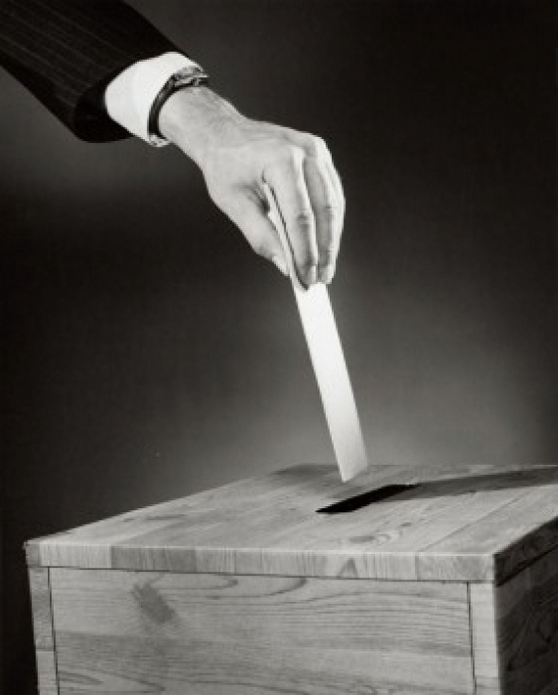 Close-up of a persons hand dropping a ballot into a ballot box Canvas Art - (24 x 36)