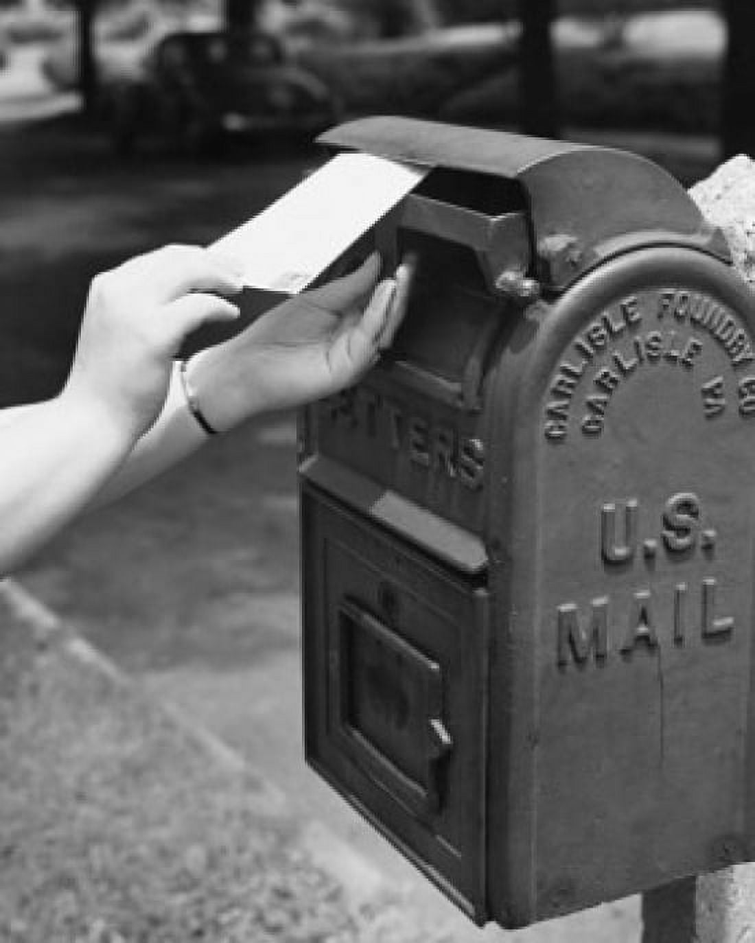 Close-up of a persons hand dropping a letter into a mailbox Canvas Art - (18 x 24)