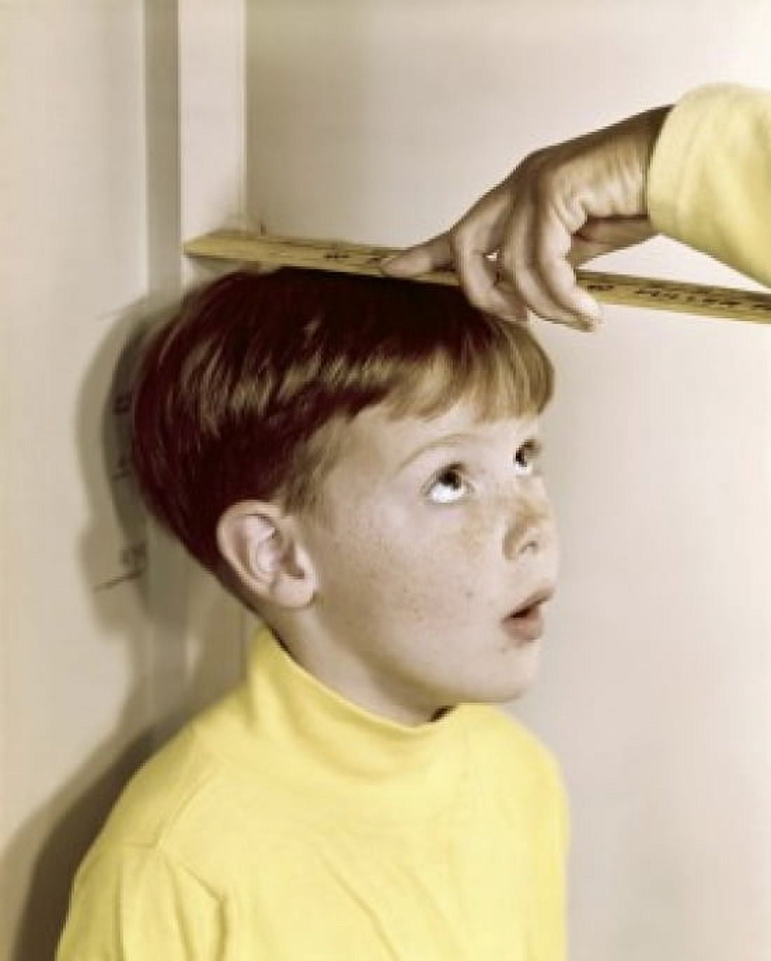 Close-up of a persons hand measuring a boys height Canvas Art - (18 x 24)