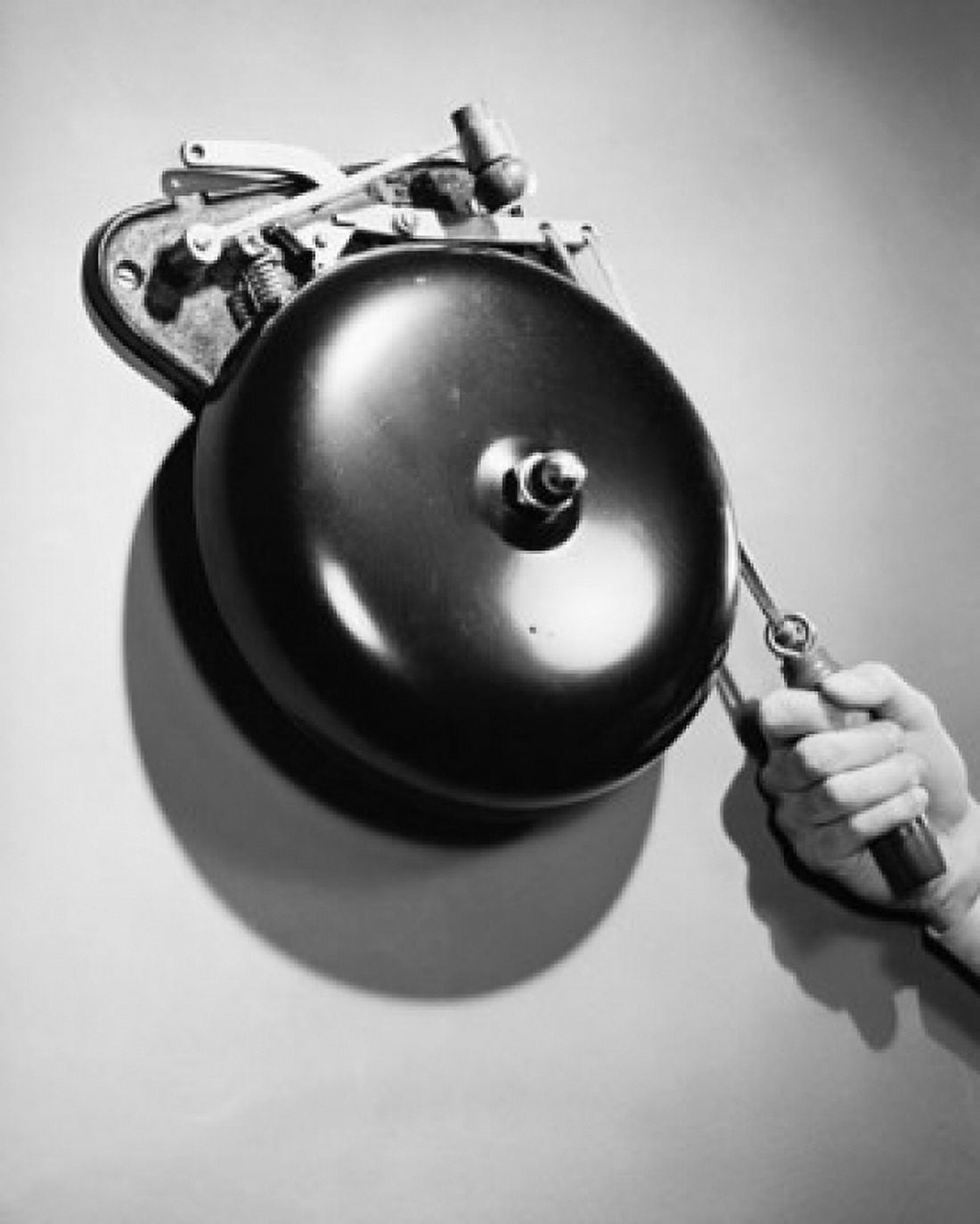 Close-up of a persons hand ringing a bell Canvas Art - (18 x 24)