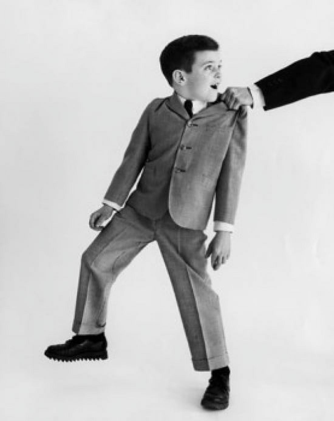 Close-up of a persons hand tugging a boy by his coat Canvas Art - (18 x 24)