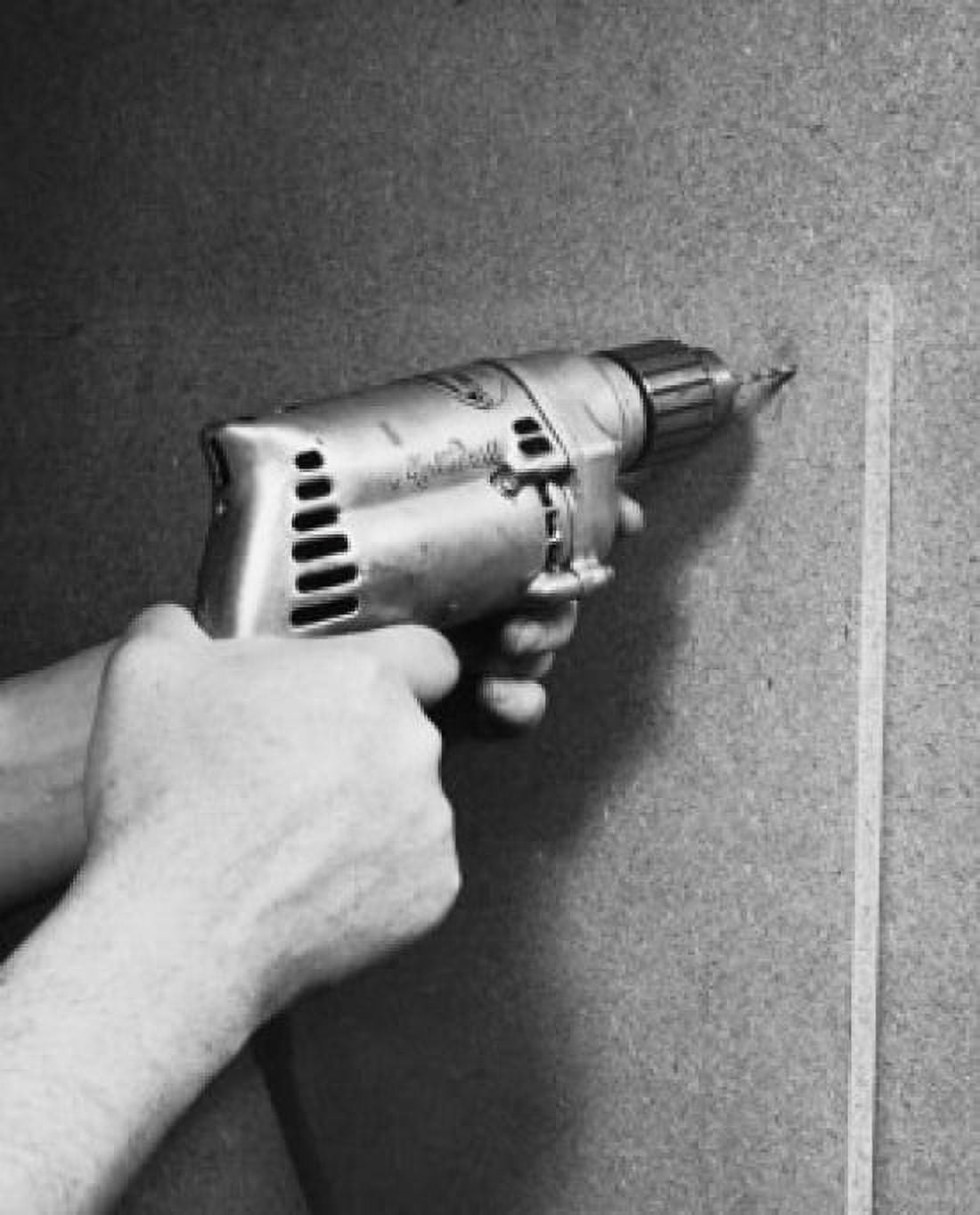 Close-up of a persons hands drilling into a wall Canvas Art - (18 x 24)