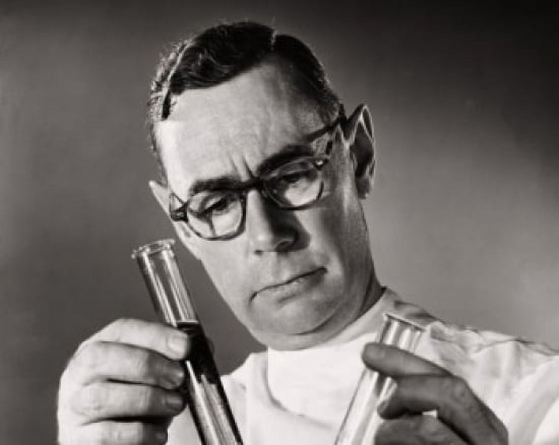 Close-up of a scientist comparing chemicals in two test tubes Canvas Art - (18 x 24)