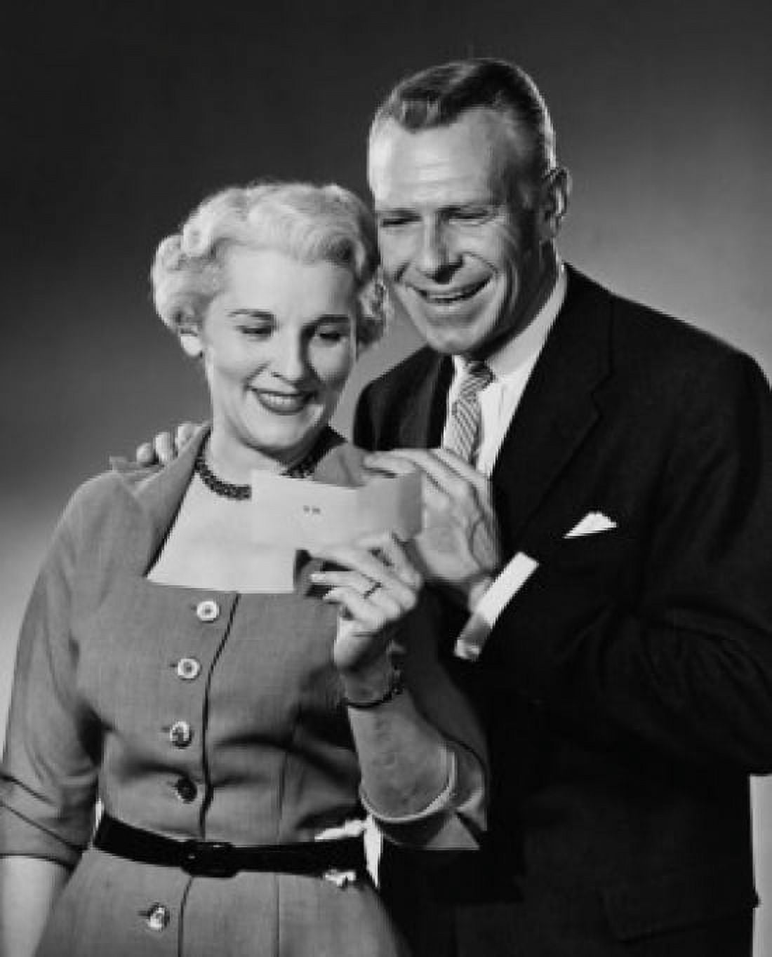 Close-up of a senior couple looking at a check Canvas Art - (18 x 24)