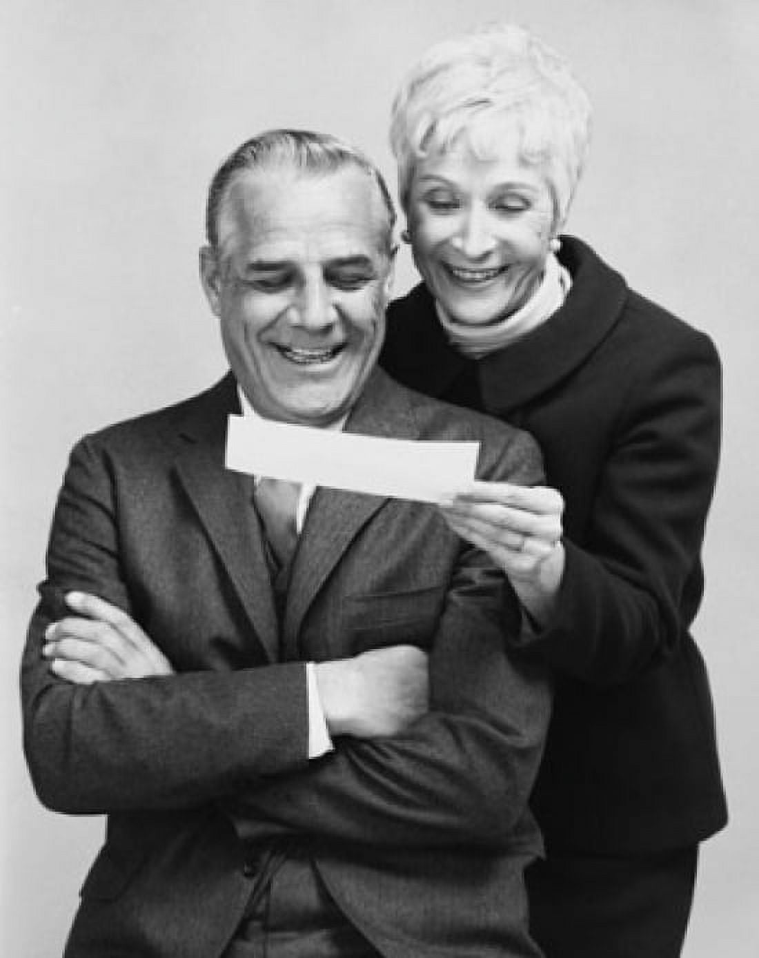 Close-up of a senior couple looking at a check and smiling Canvas Art - (18 x 24)