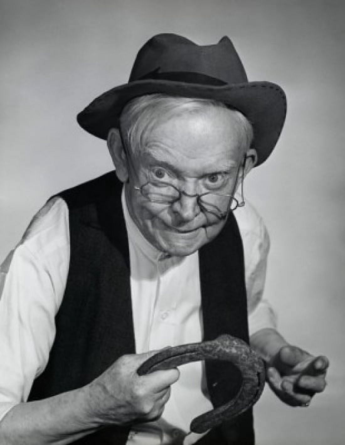 Close-up of a senior man holding a horseshoe Canvas Art - (18 x 24)