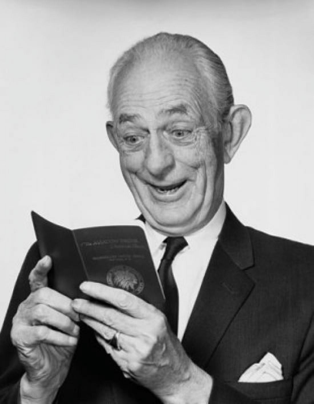 Close-up of a senior man looking at a bankbook and smiling Canvas Art - (24 x 36)
