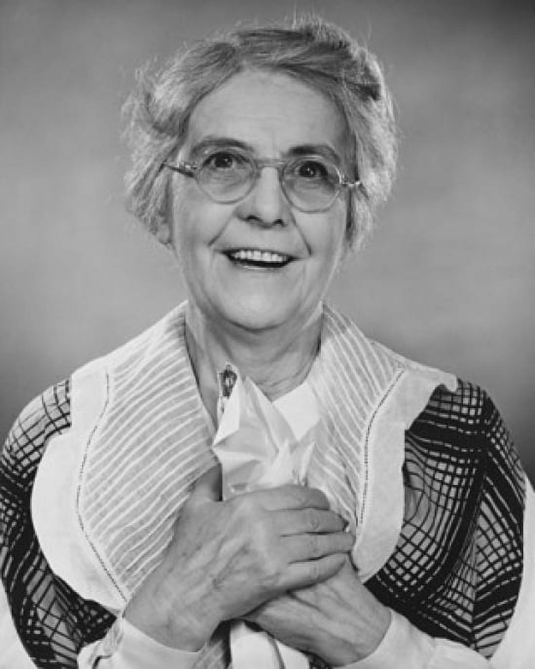 Close-up of a senior woman holding a paper and smiling Canvas Art - (24 x 36)