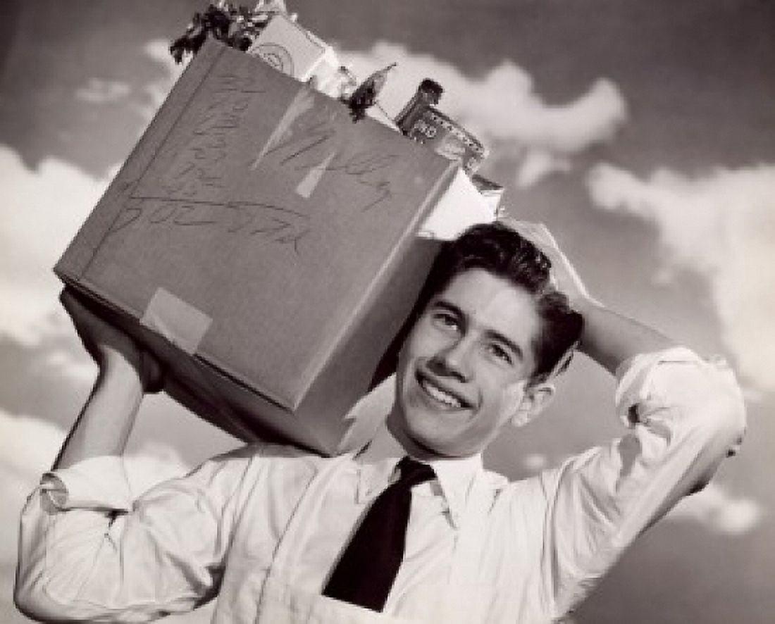 Close-up of a teenage boy carrying a cardboard box on his shoulders Canvas Art - (24 x 36)