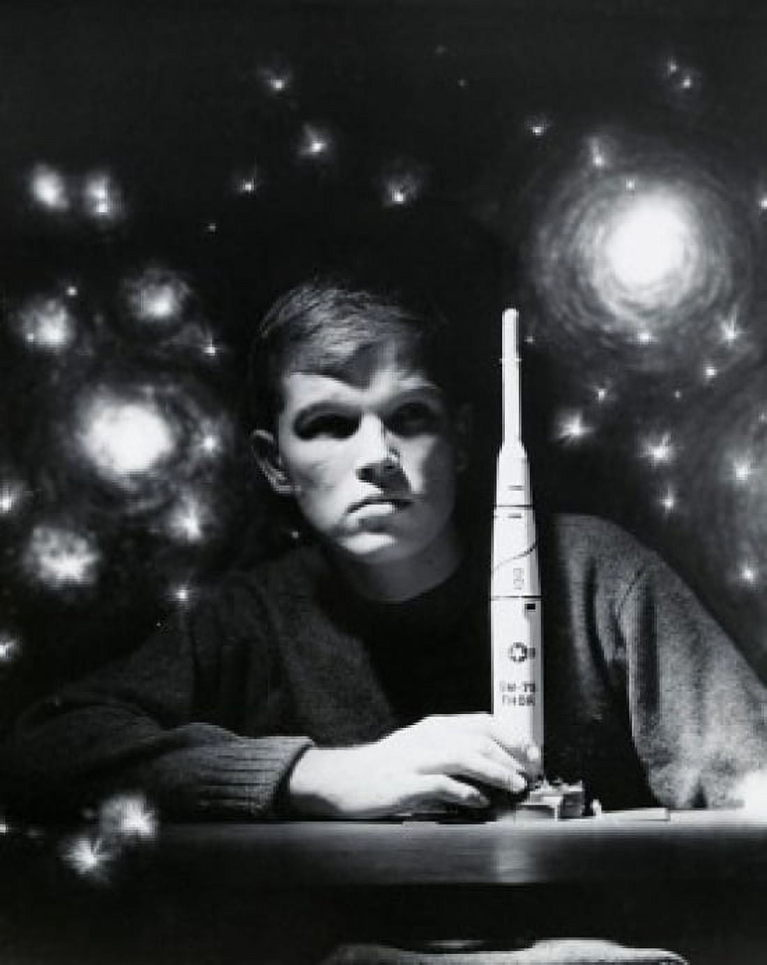 Close-up of a teenage boy holding a model rocket Canvas Art - (18 x 24)