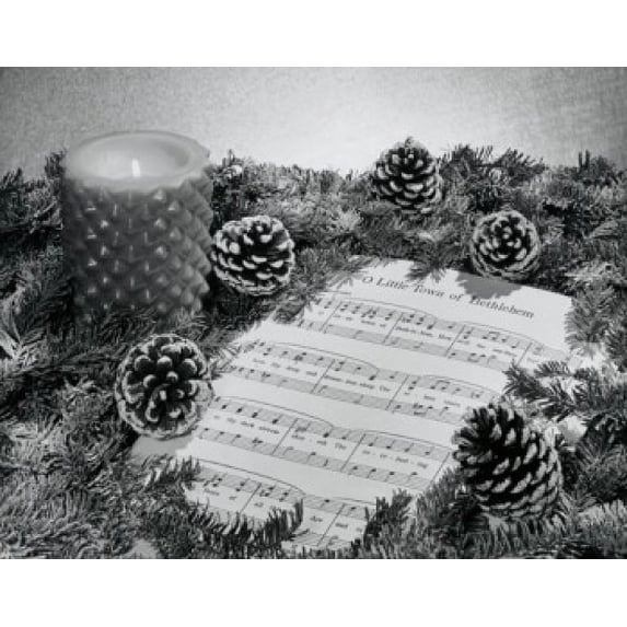 Close-up of a wreath with a burning candle on sheet music Poster Print (18 x 24)
