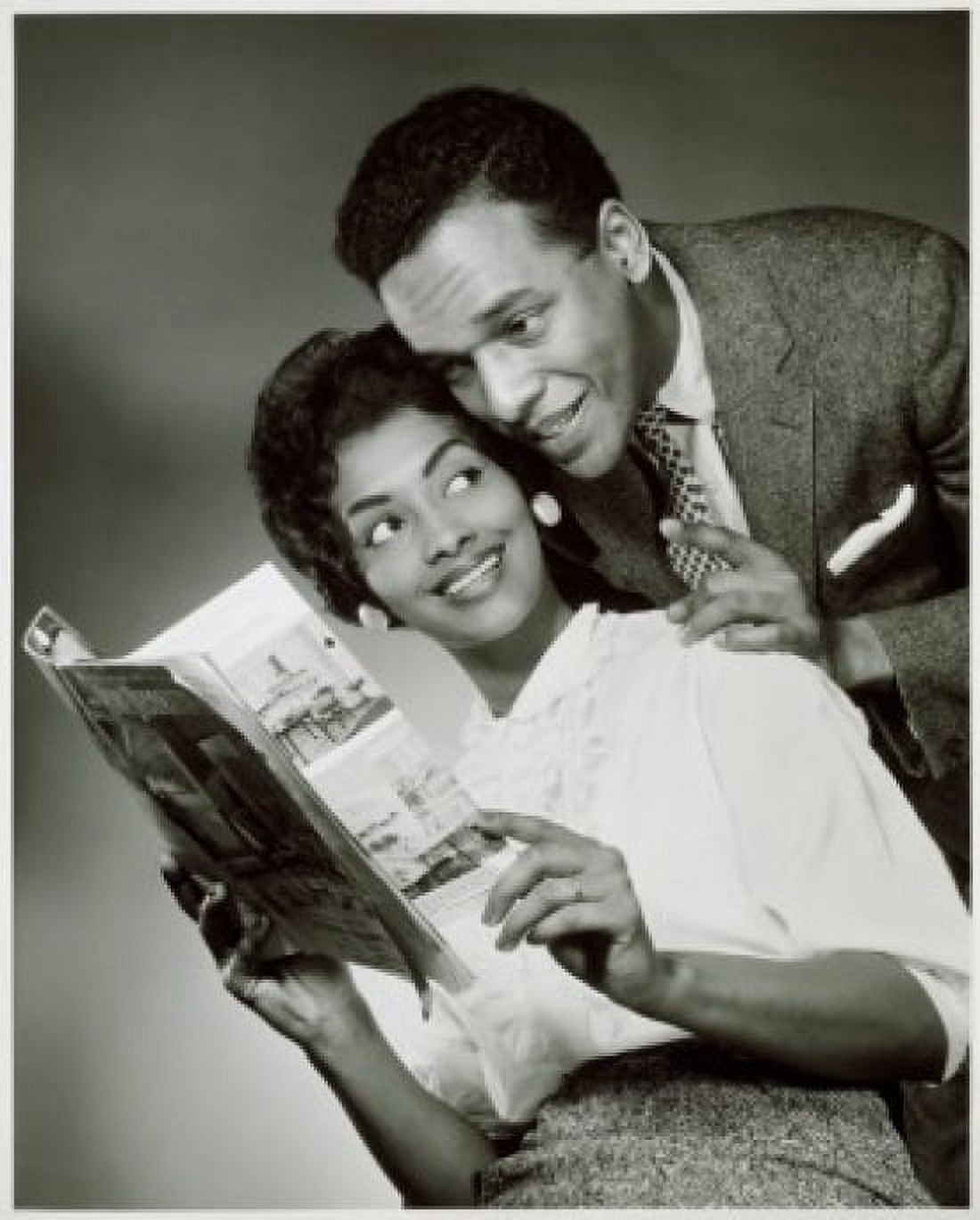 Close-up of a young couple looking at a catalog Canvas Art - (18 x 24)