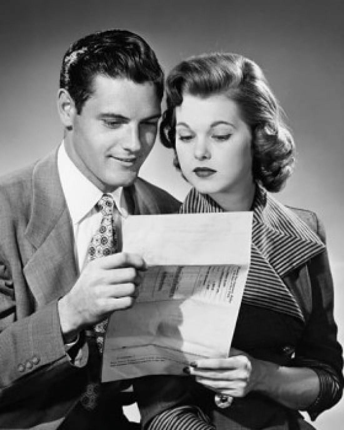 Close-up of a young couple reading a document Canvas Art - (18 x 24)