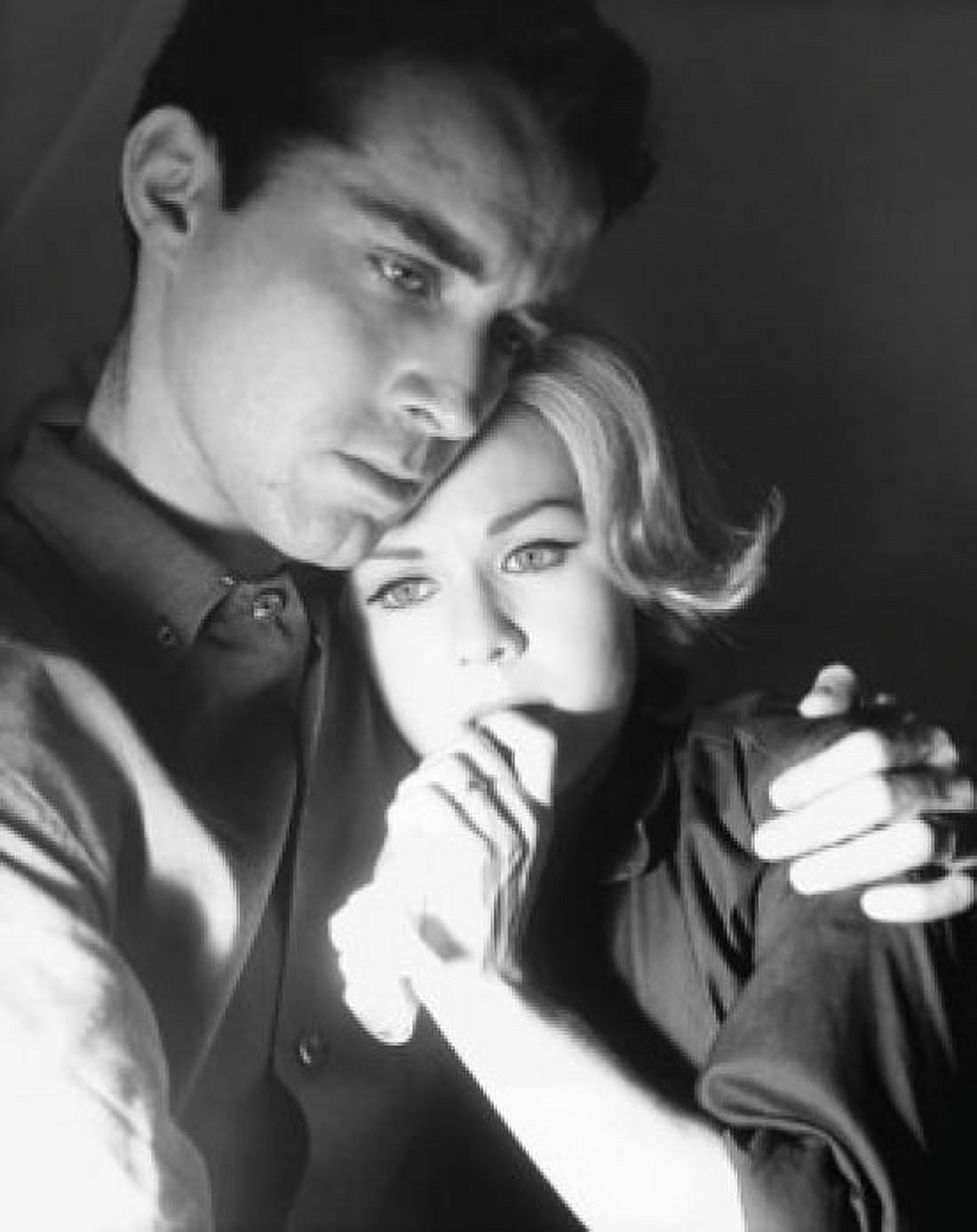 Close-up of a young man embracing a young woman and looking serious Canvas Art -  (24 x 36)