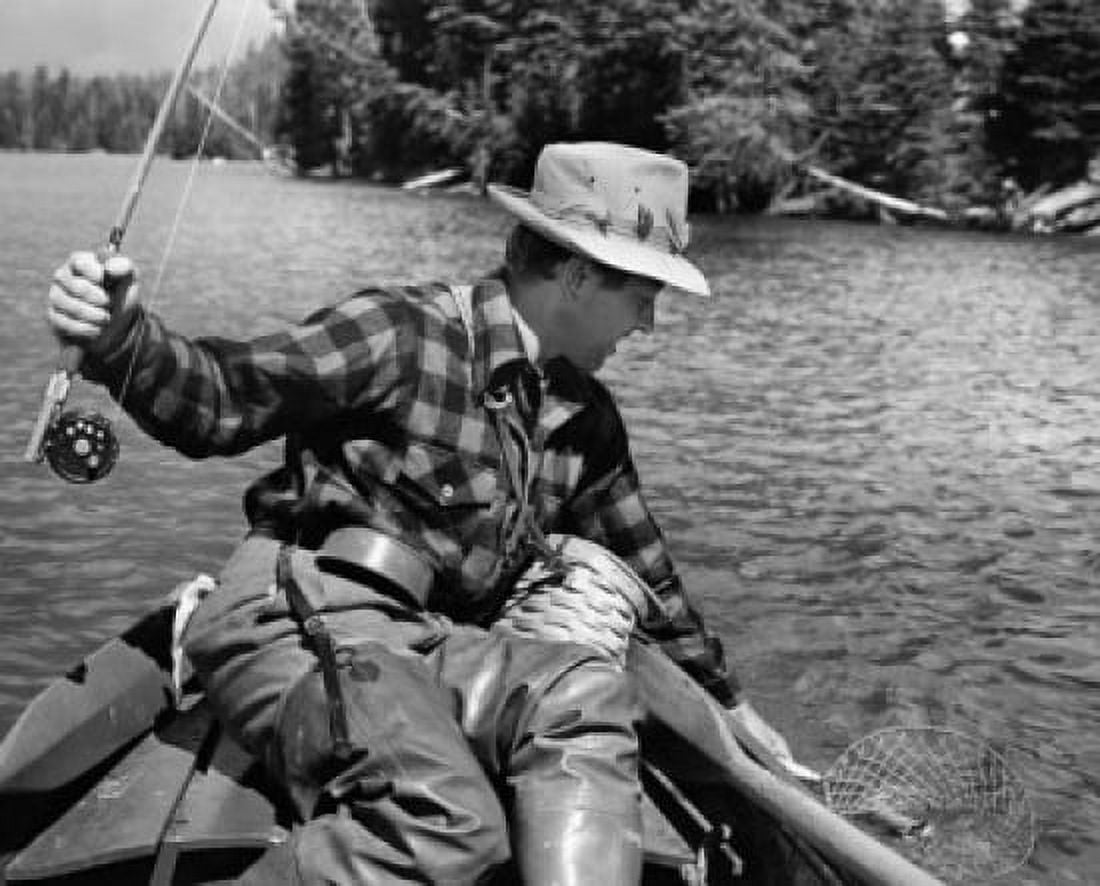 Close-up of a young man fishing for trout in a lake Yellowstone Lake Yellowstone National Park Wyoming USA Canvas Art - (24 x 36)