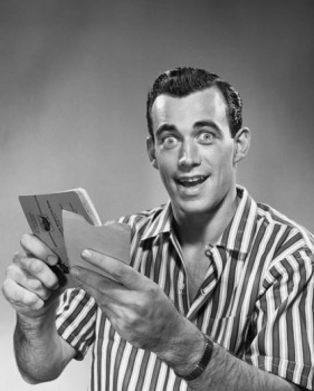 Close-up of a young man holding a bankbook and an envelope Canvas Art - (18 x 24)
