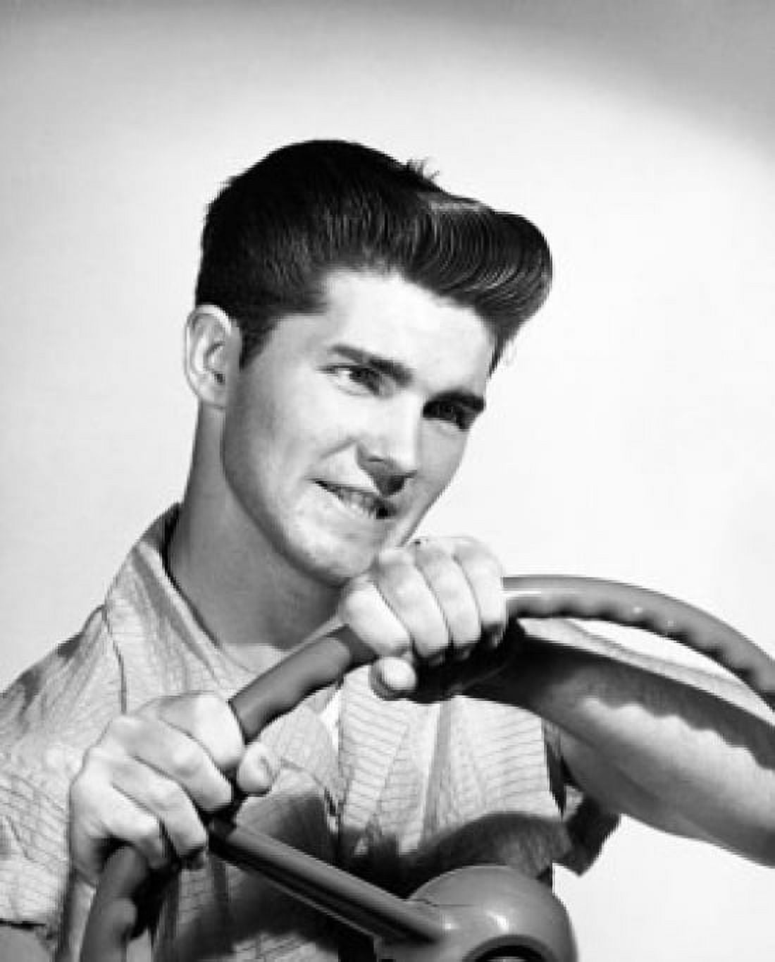 Close-up of a young man holding a steering wheel Canvas Art - (24 x 36)