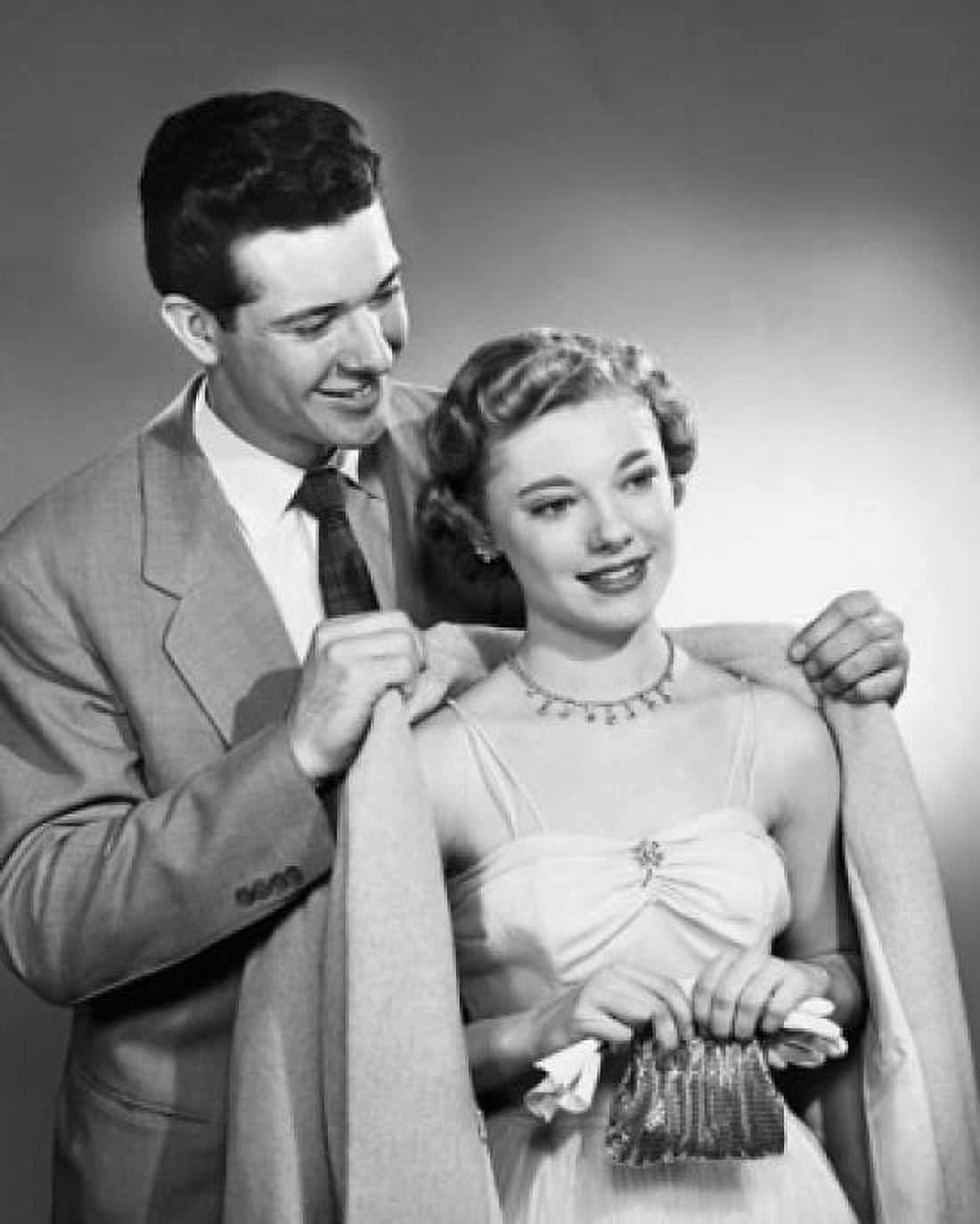 Close-up of a young man putting an overcoat on a young woman Canvas Art - (18 x 24)