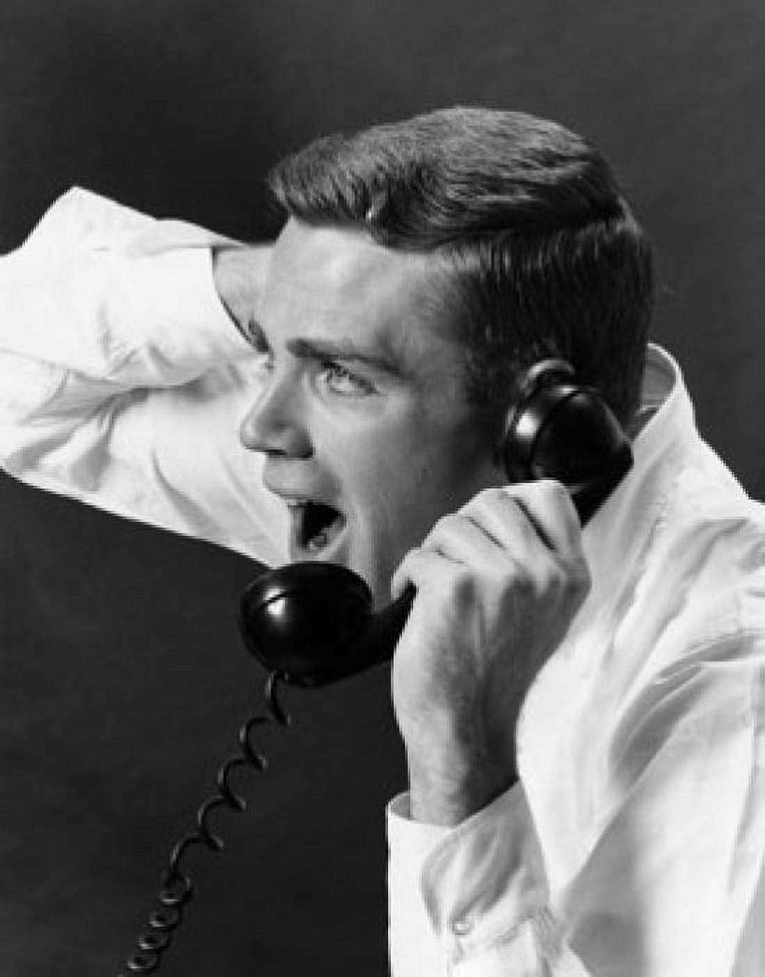 Close-up of a young man shouting on the telephone Canvas Art - (18 x 24)