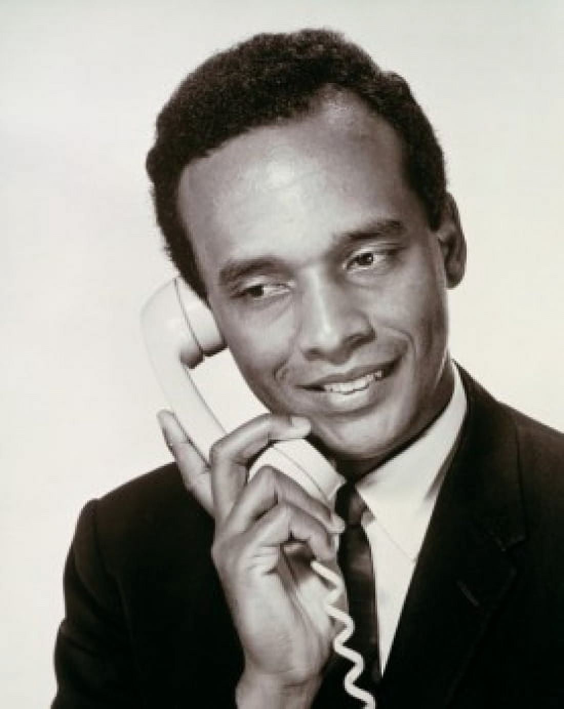 Close-up of a young man using a telephone Canvas Art - (24 x 36)
