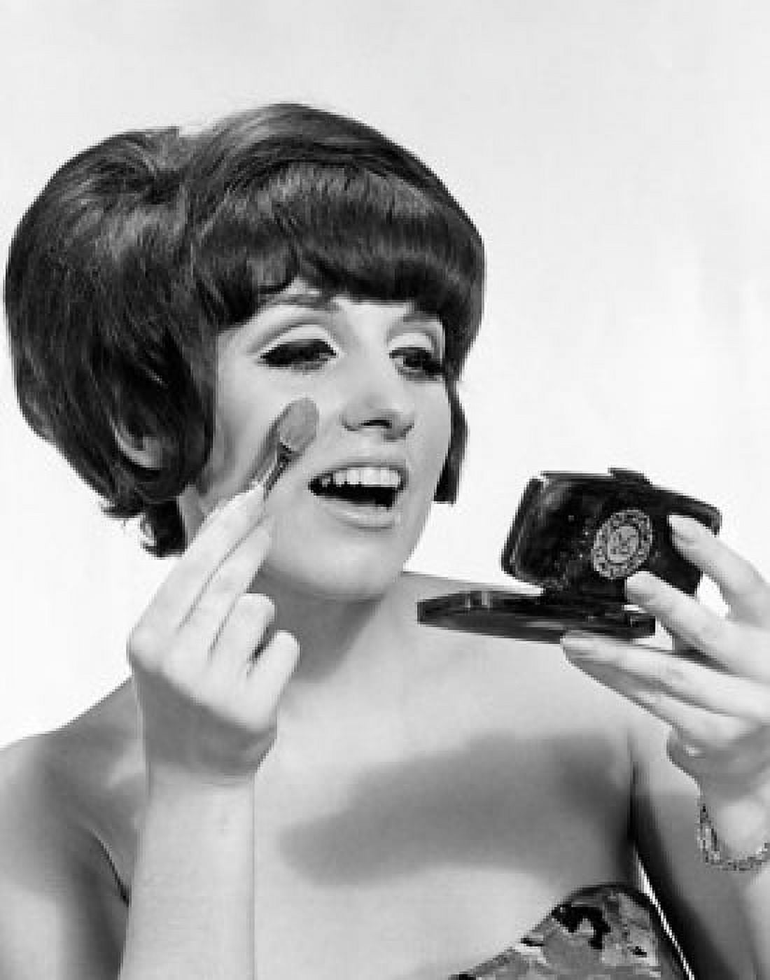 Close-up of a young woman applying face powder Canvas Art - (18 x 24)