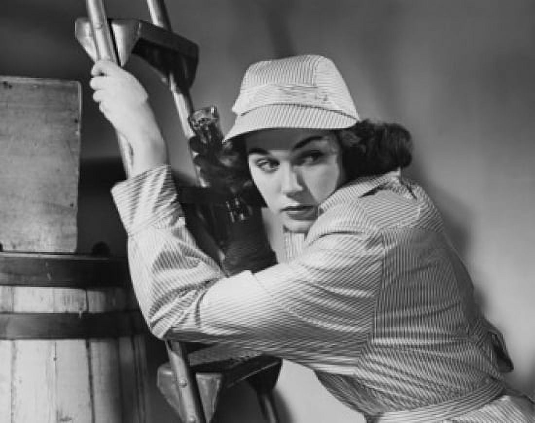 Close-up of a young woman climbing up a ladder Canvas Art - (24 x 36)
