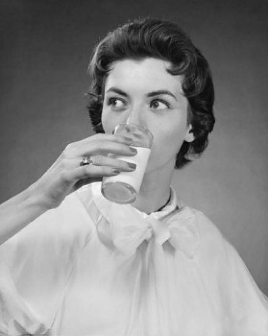 Close-up of a young woman drinking milk Canvas Art - (18 x 24)
