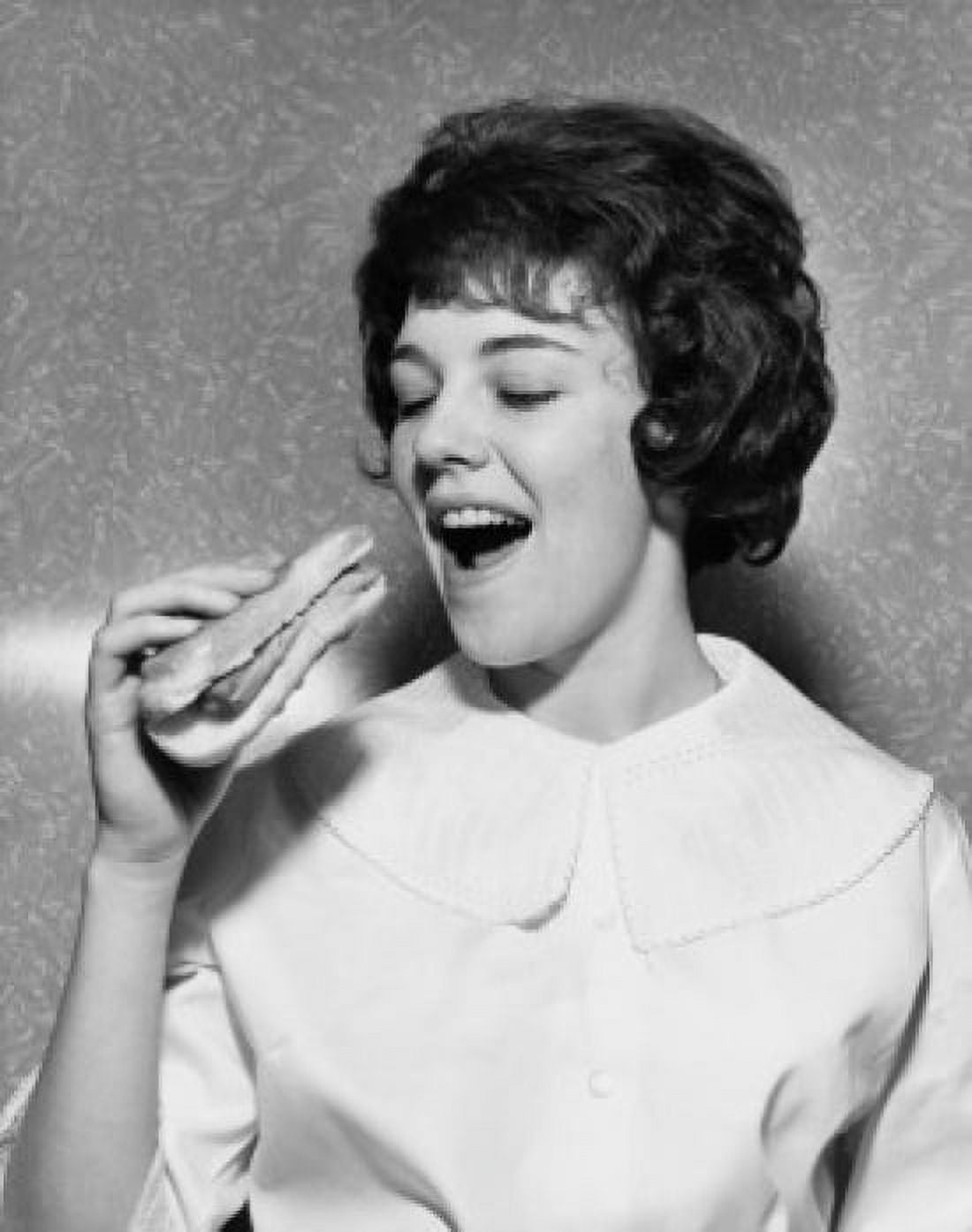 Close-up of a young woman eating a hot dog Canvas Art - (18 x 24)