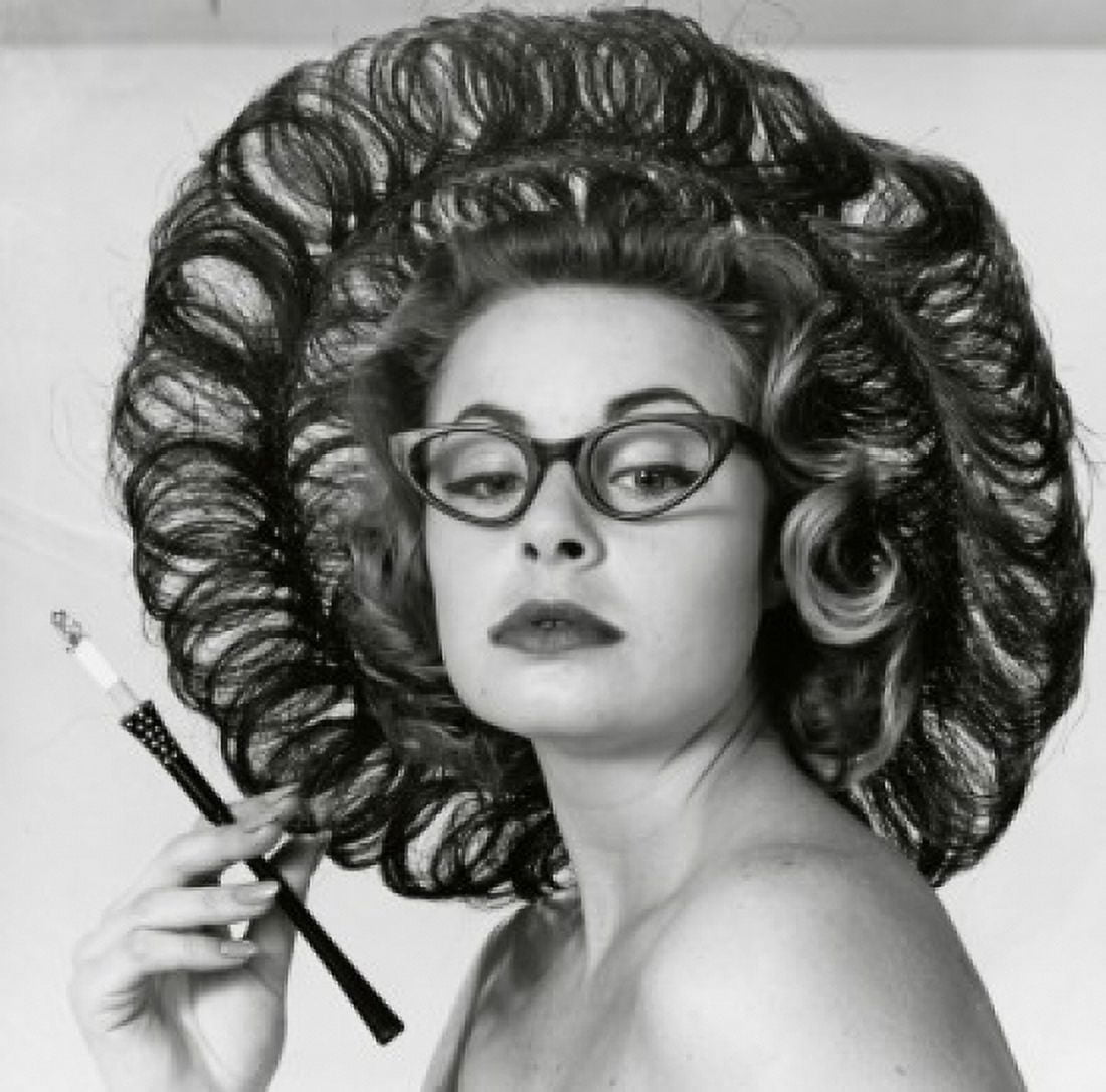 Close-up of a young woman holding a cigarette holder Canvas Art - (24 x 36)