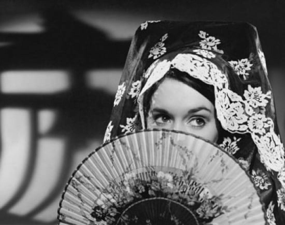 Close-up of a young woman holding a fan Canvas Art - (24 x 36)