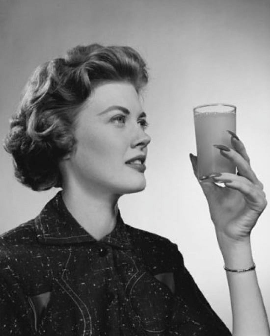 Close-up of a young woman holding a glass of juice Canvas Art - (24 x 36)