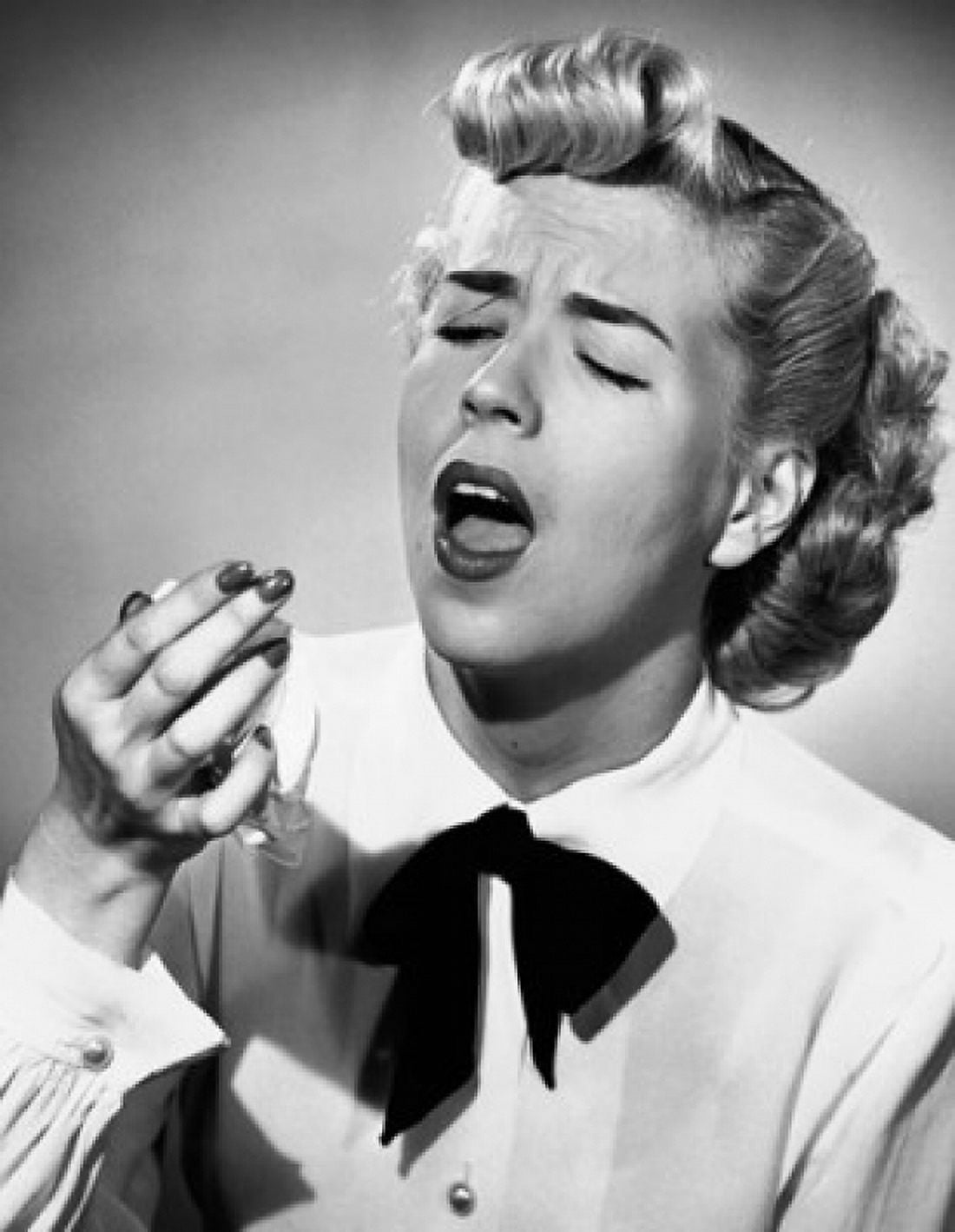 Close-up of a young woman holding a handkerchief and sneezing Canvas Art - (18 x 24)