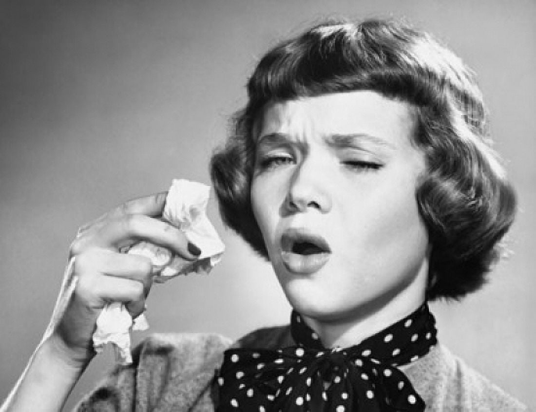 Close-up of a young woman holding a handkerchief and sneezing Canvas Art - (24 x 36)