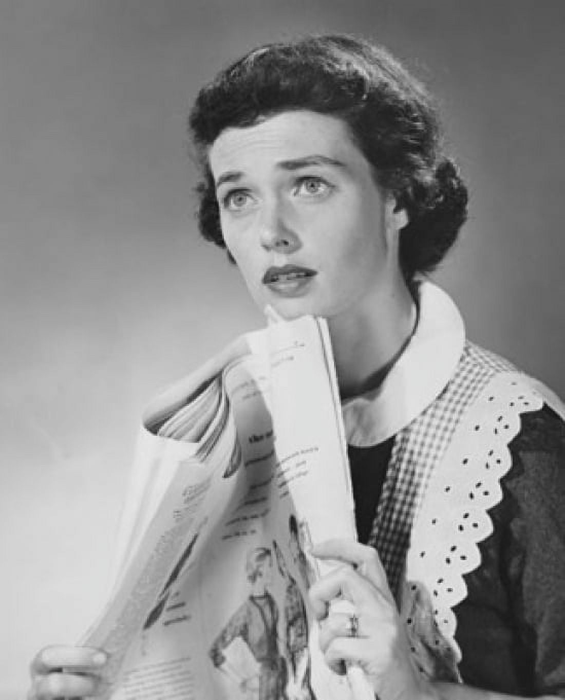 Close-up of a young woman holding a newspaper Canvas Art - (18 x 24)