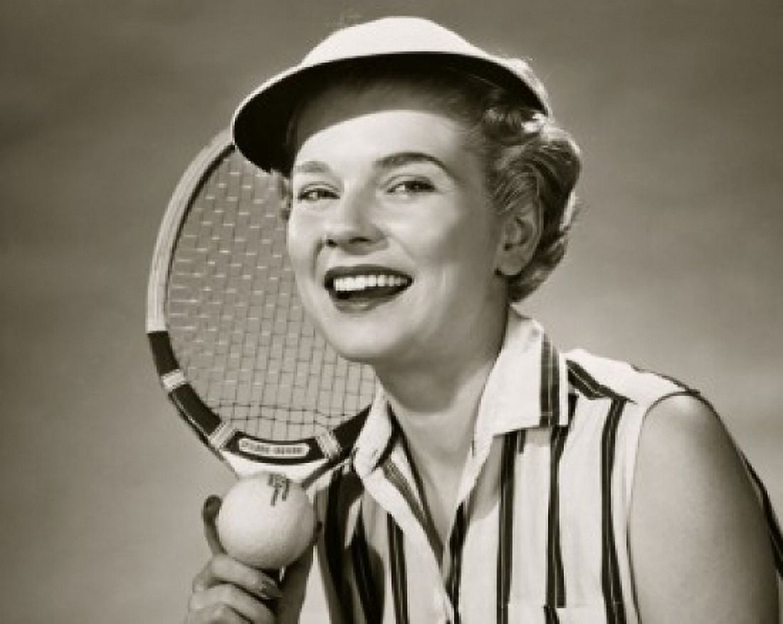 Close-up of a young woman holding a tennis ball and a tennis racket Canvas Art -  (24 x 36)