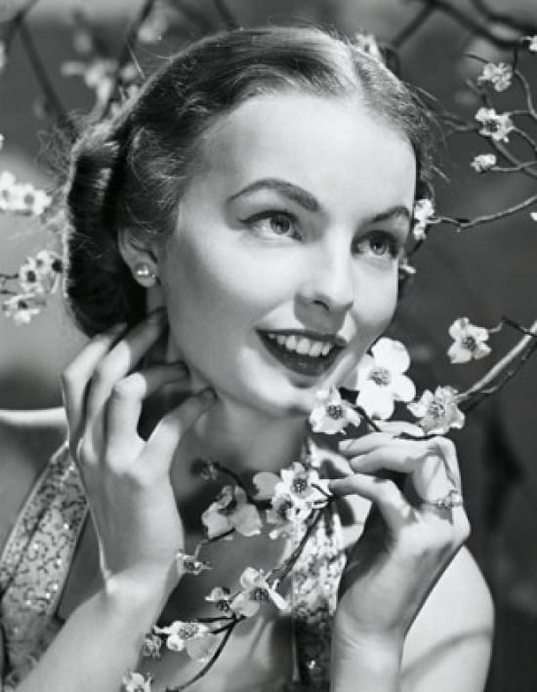 Close-up of a young woman holding dogwood blossoms Canvas Art - (18 x 24)