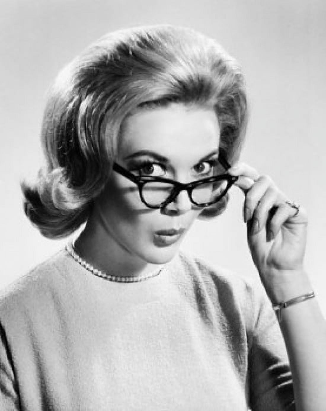 Close-up of a young woman holding eyeglasses Canvas Art - (18 x 24)