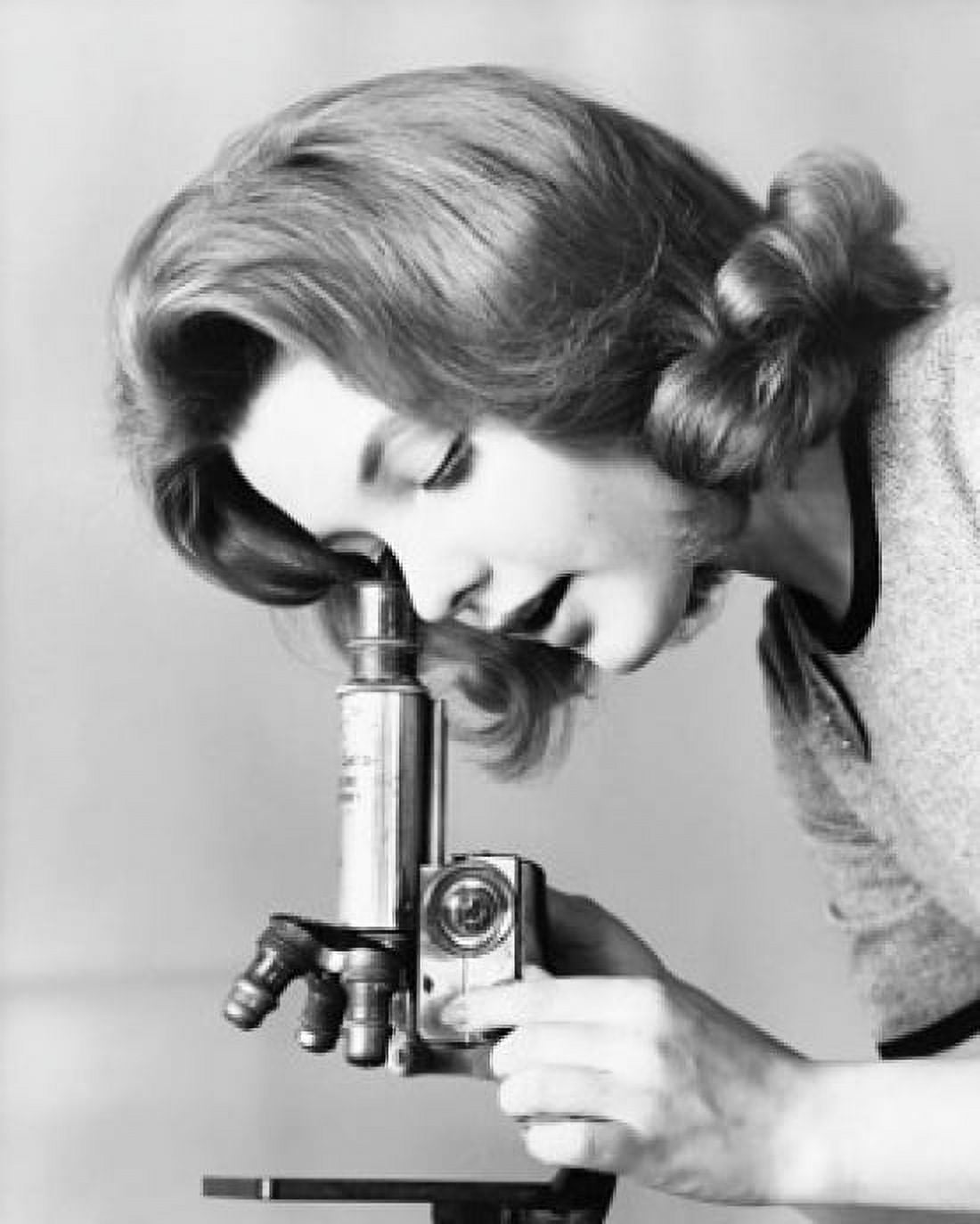 Close-up of a young woman looking through a microscope Canvas Art -  (24 x 36)