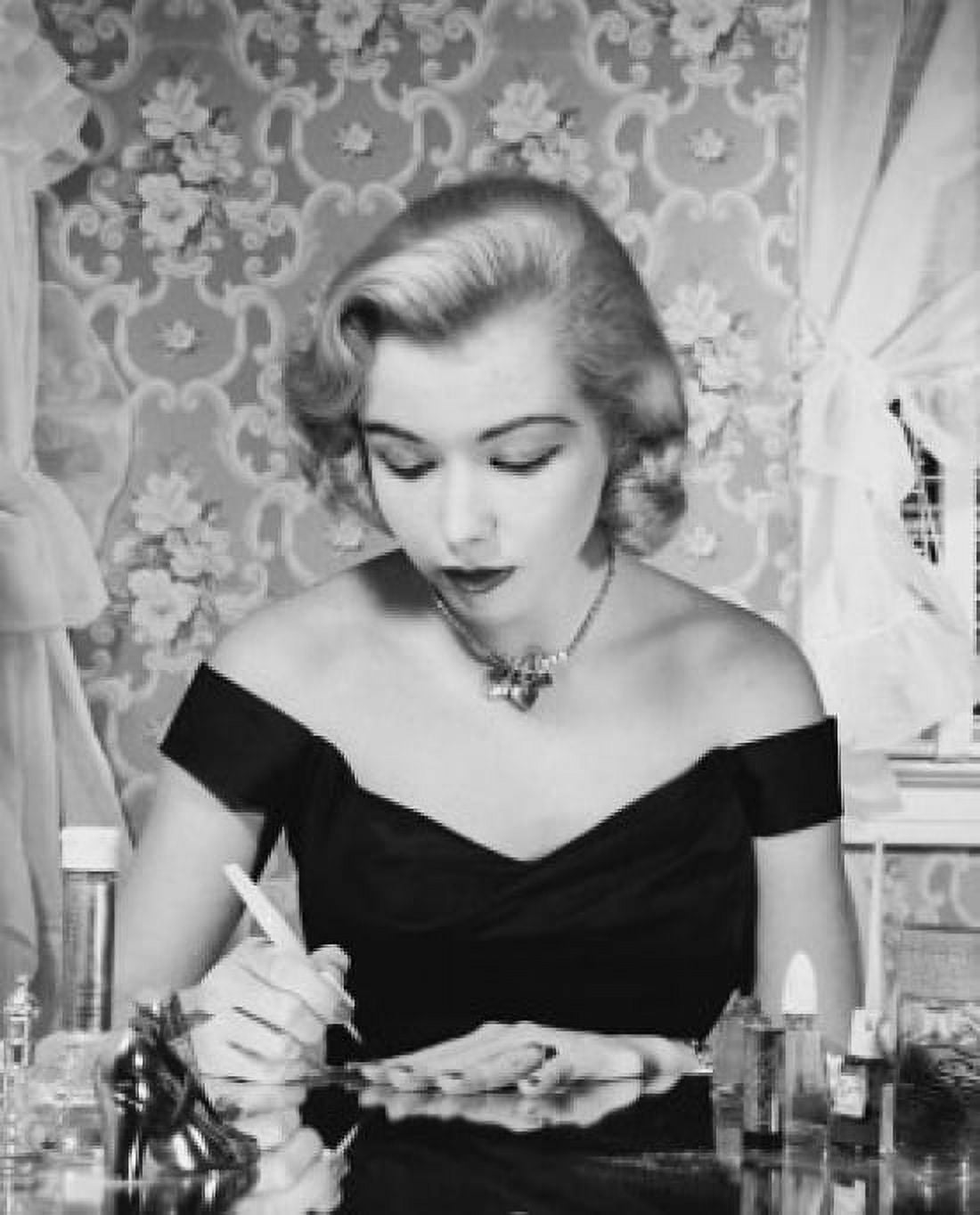 Close-up of a young woman painting her fingernails Canvas Art - (24 x 36)