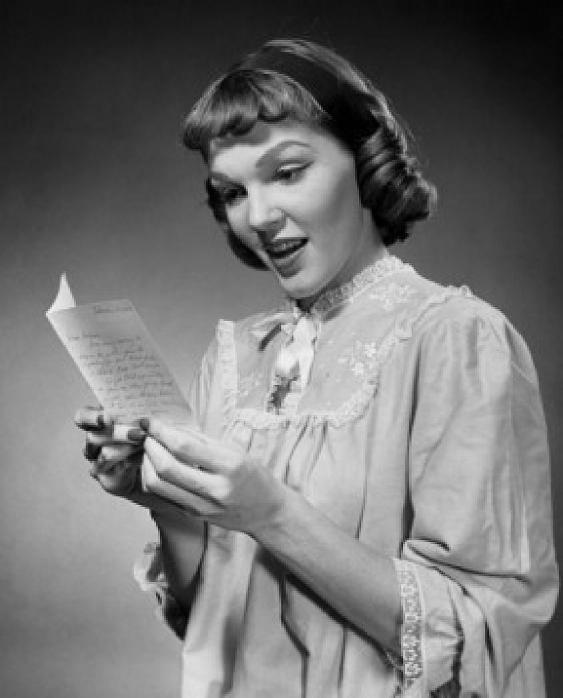 Close-up of a young woman reading a letter Canvas Art - (24 x 36)