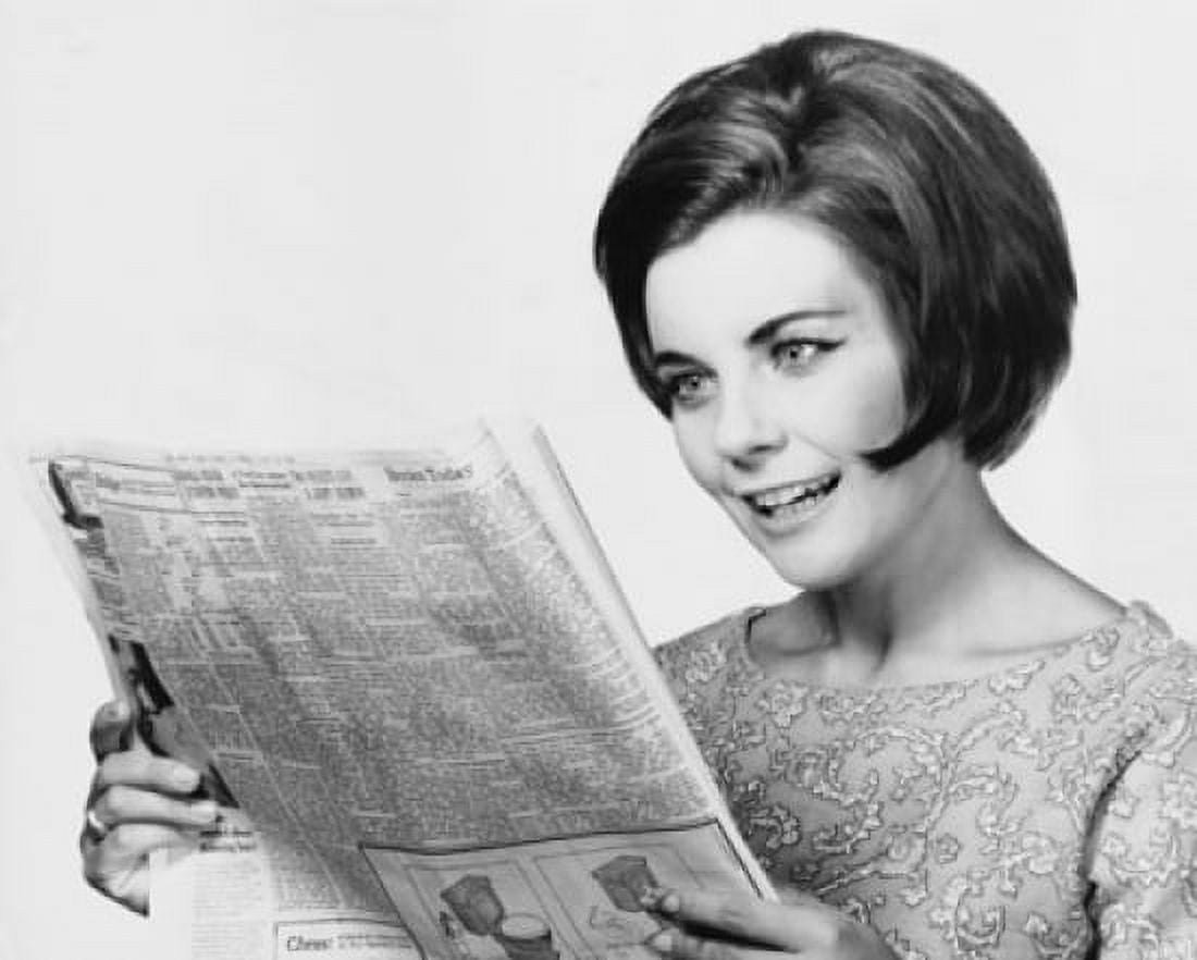 Close-up of a young woman reading a newspaper Canvas Art - (18 x 24)