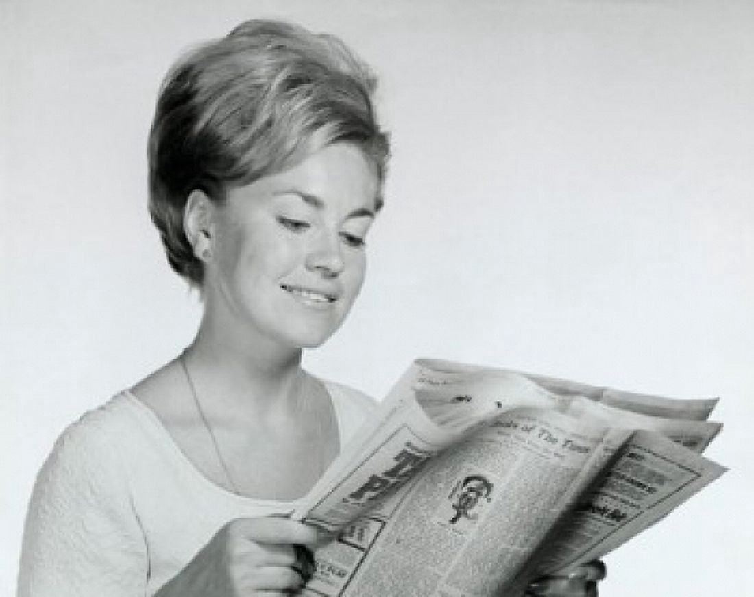 Close-up of a young woman reading a newspaper Canvas Art - (18 x 24)