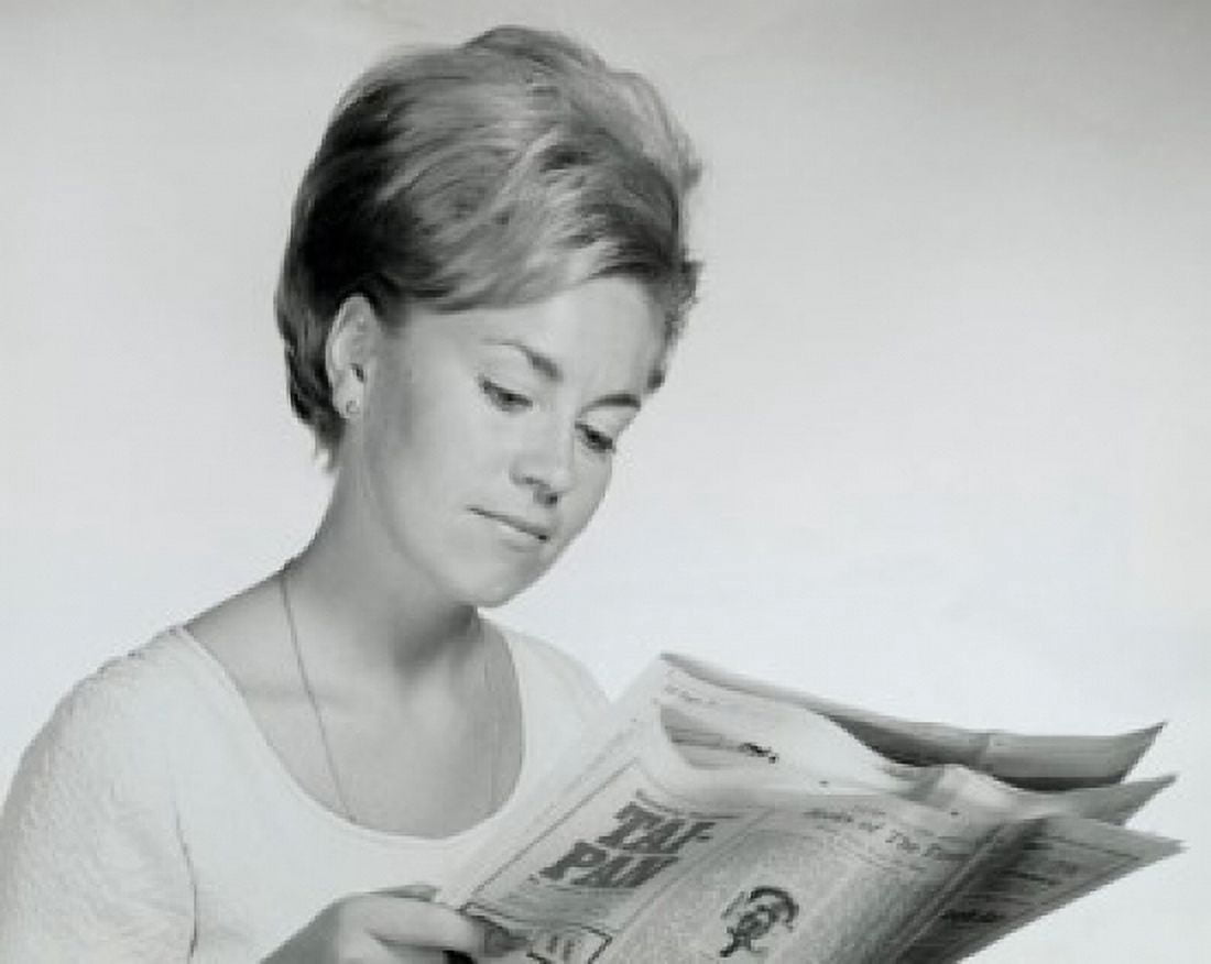 Close-up of a young woman reading a newspaper Canvas Art - (18 x 24)