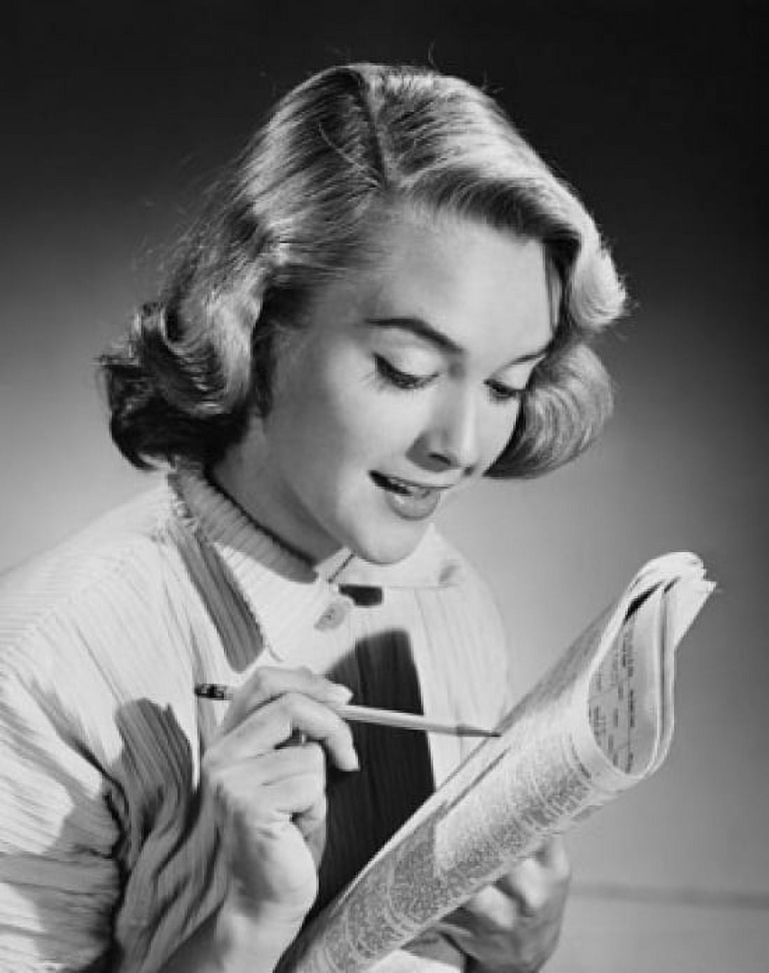 Close-up of a young woman reading a newspaper Canvas Art - (18 x 24)