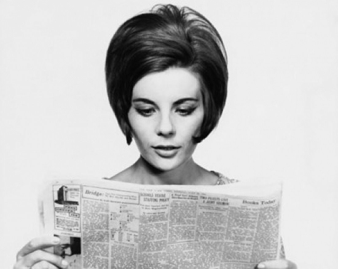 Close-up of a young woman reading a newspaper Canvas Art - (24 x 36)