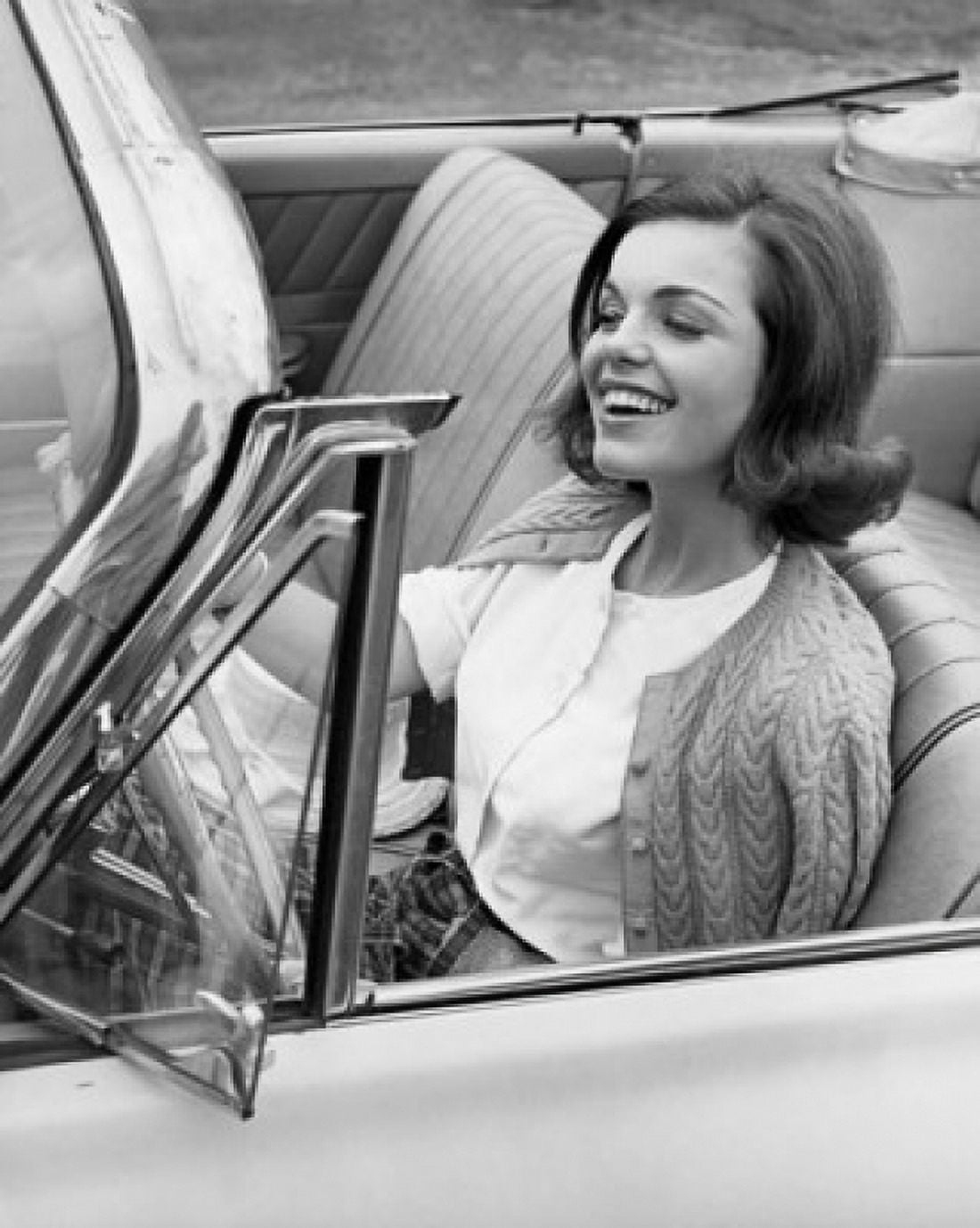 Close-up of a young woman sitting in a car and smiling Canvas Art -  (18 x 24)